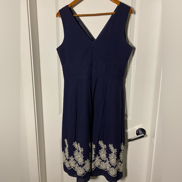 Navy blue V-neck, empire waist dress with floral-embroidered detail at bottom - Picture 4 of 5